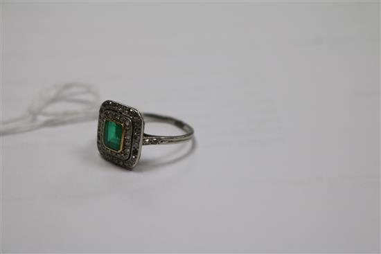 A white metal, emerald and diamond tablet cluster ring, size K.